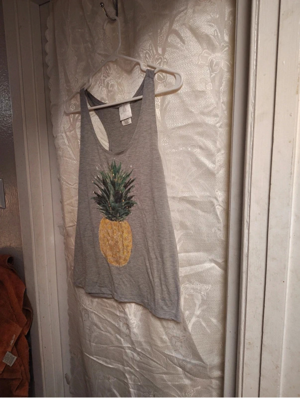 Jerry Leigh sequinned pineapple on a grey racerback Tank
